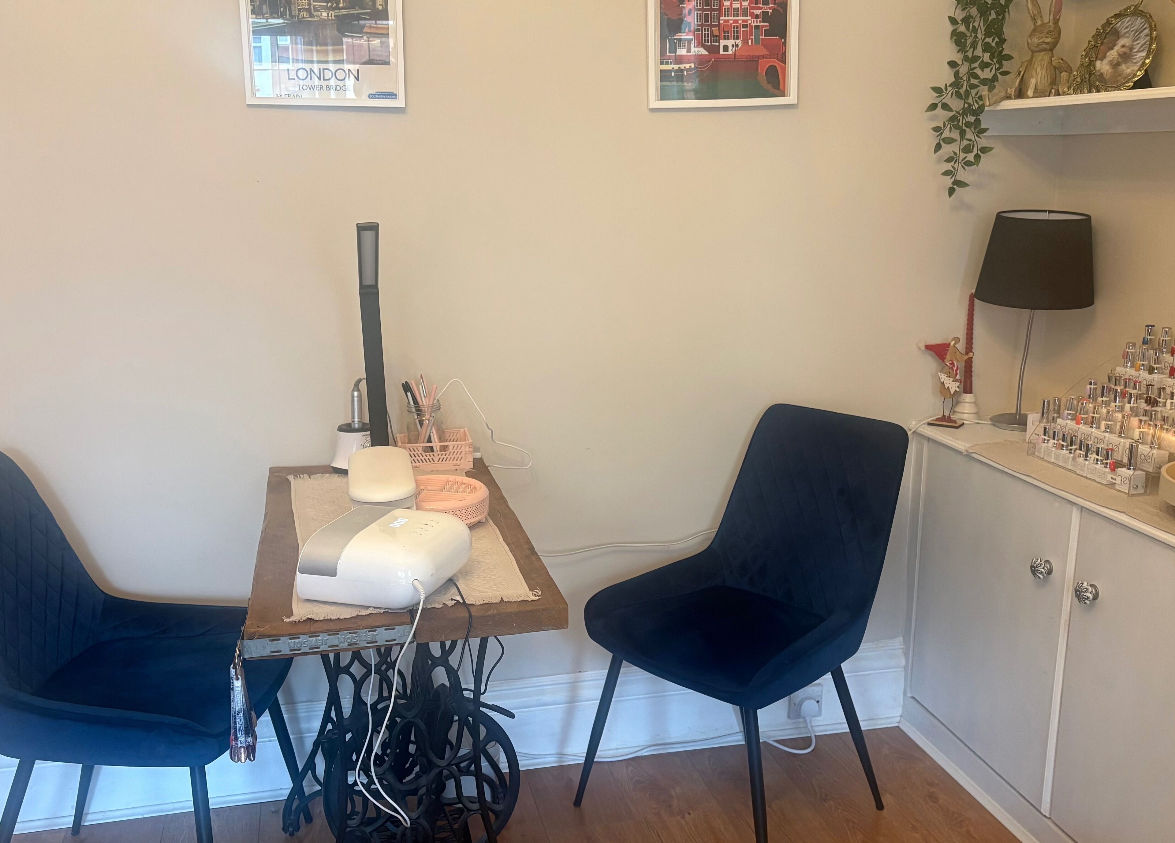 Inviting nail station at Nails by Dena, Blackpool, England, GB, featuring chairs and nail polish display.