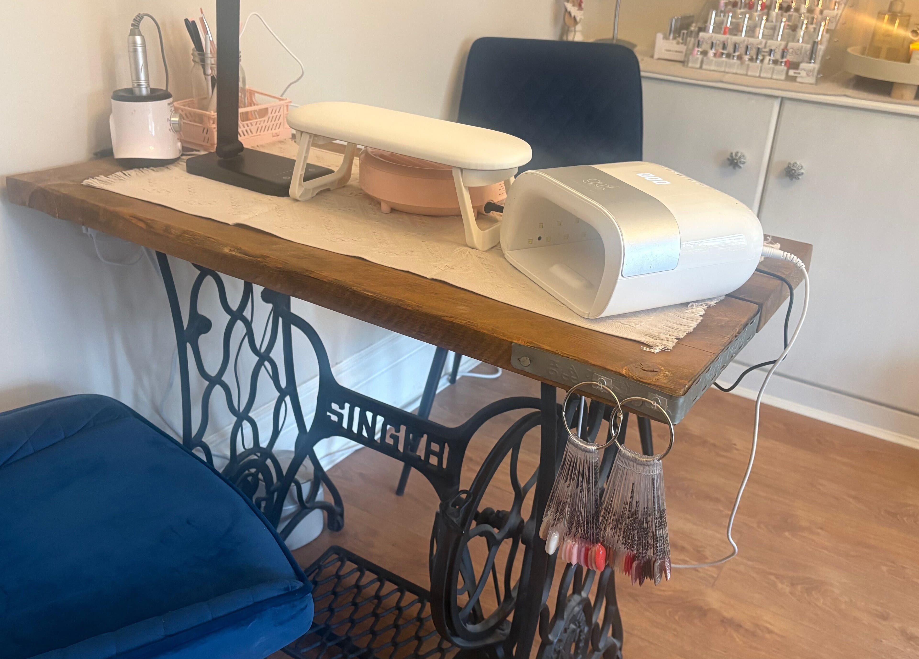 Nail station setup at Nails by Dena in Blackpool, England, GB with manicure tools and a comfy chair.