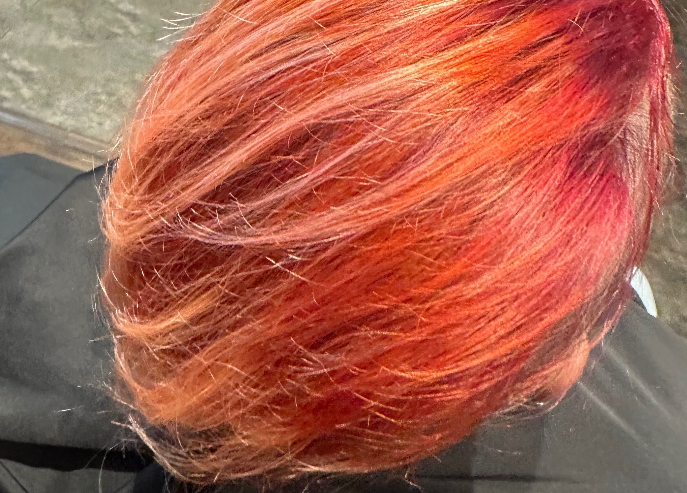 Vibrant red hair coloring at Tropical Rayz: Elena Garcia, Oskaloosa, Iowa, US.