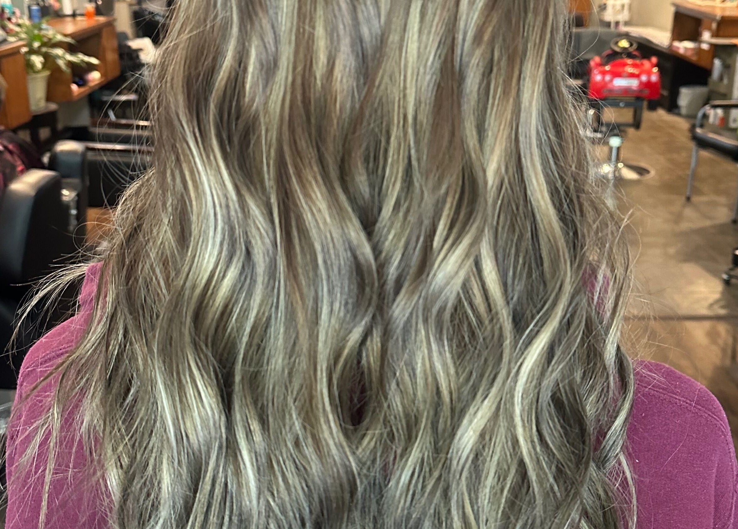 Wavy blonde hairstyle at Tropical Rayz: Elena Garcia, Oskaloosa, Iowa, US.