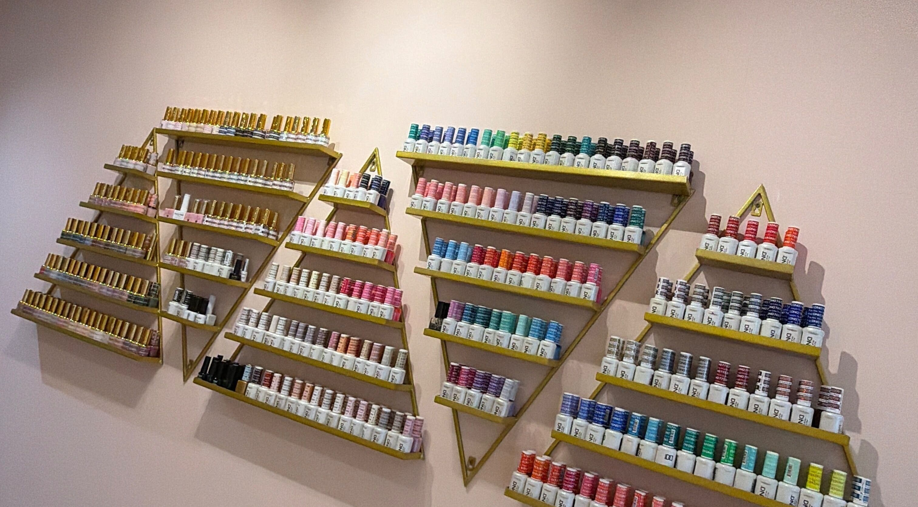 Colorful nail polish shelves at Hampstead Medspa, London, England, GB featuring vibrant options.