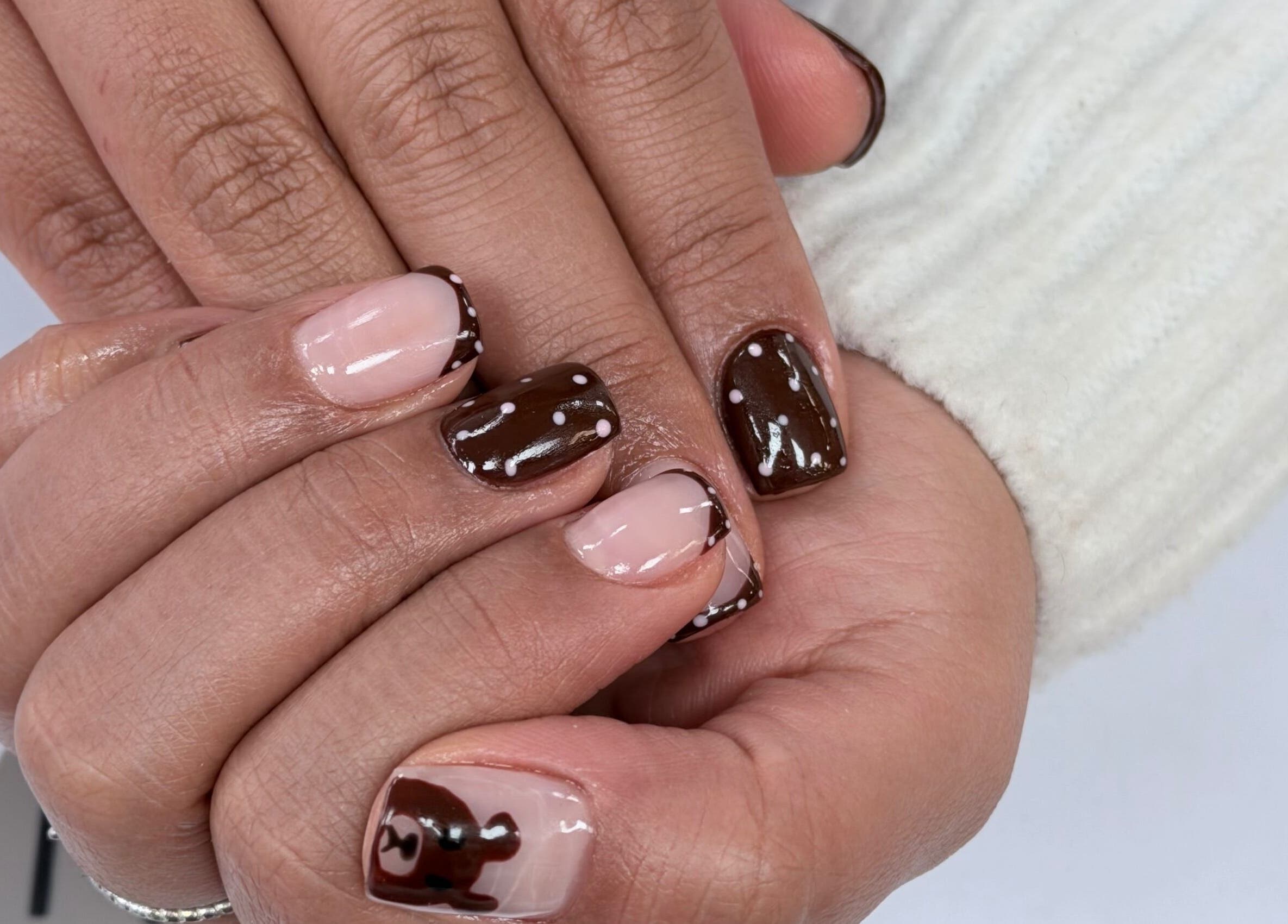 Elegant nail art service at Hampstead Medspa, London, England, GB, featuring stylish brown designs.