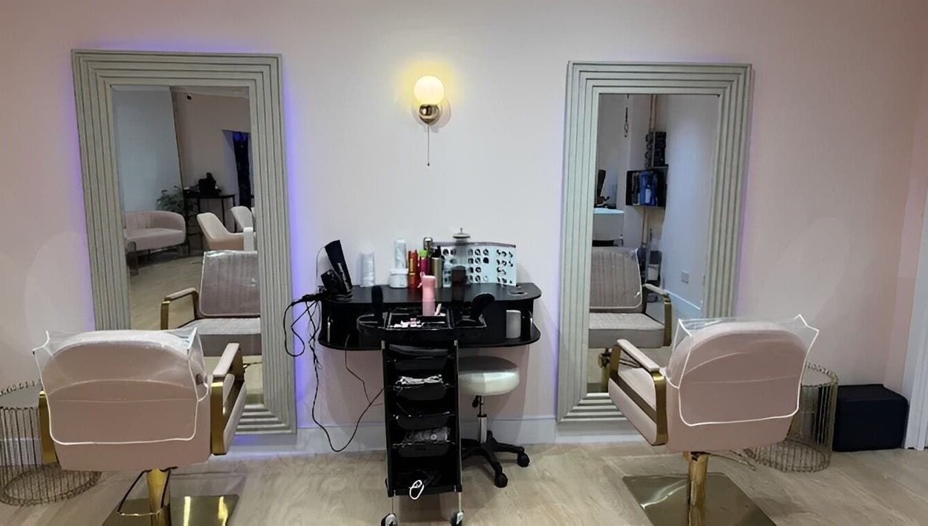 Interior of Hampstead Medspa in London, England, GB showcasing chic styling chairs and mirrors.