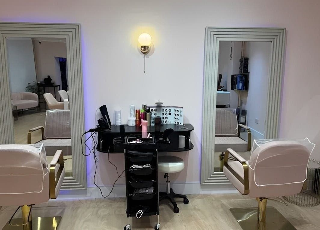 Interior of Hampstead Medspa in London, England, GB showcasing chic styling chairs and mirrors.