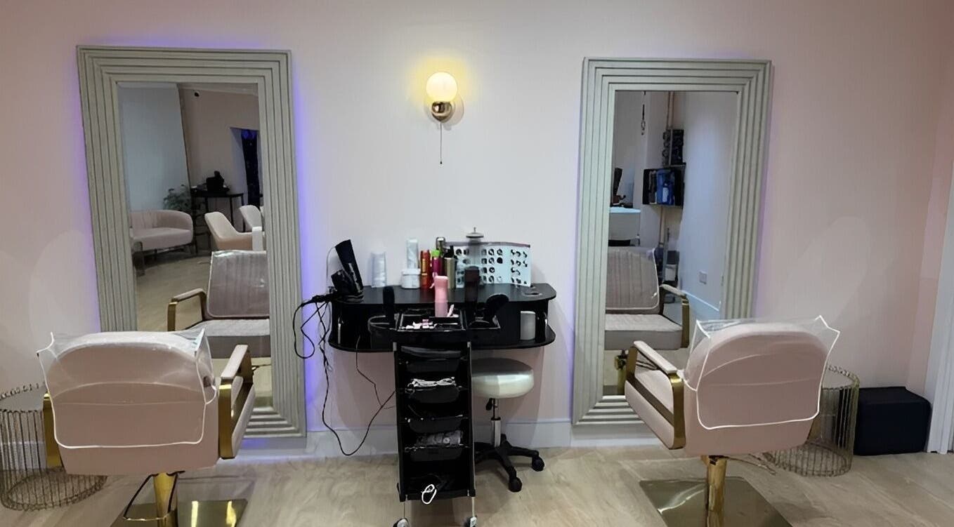 Interior of Hampstead Medspa in London, England, GB showcasing chic styling chairs and mirrors.