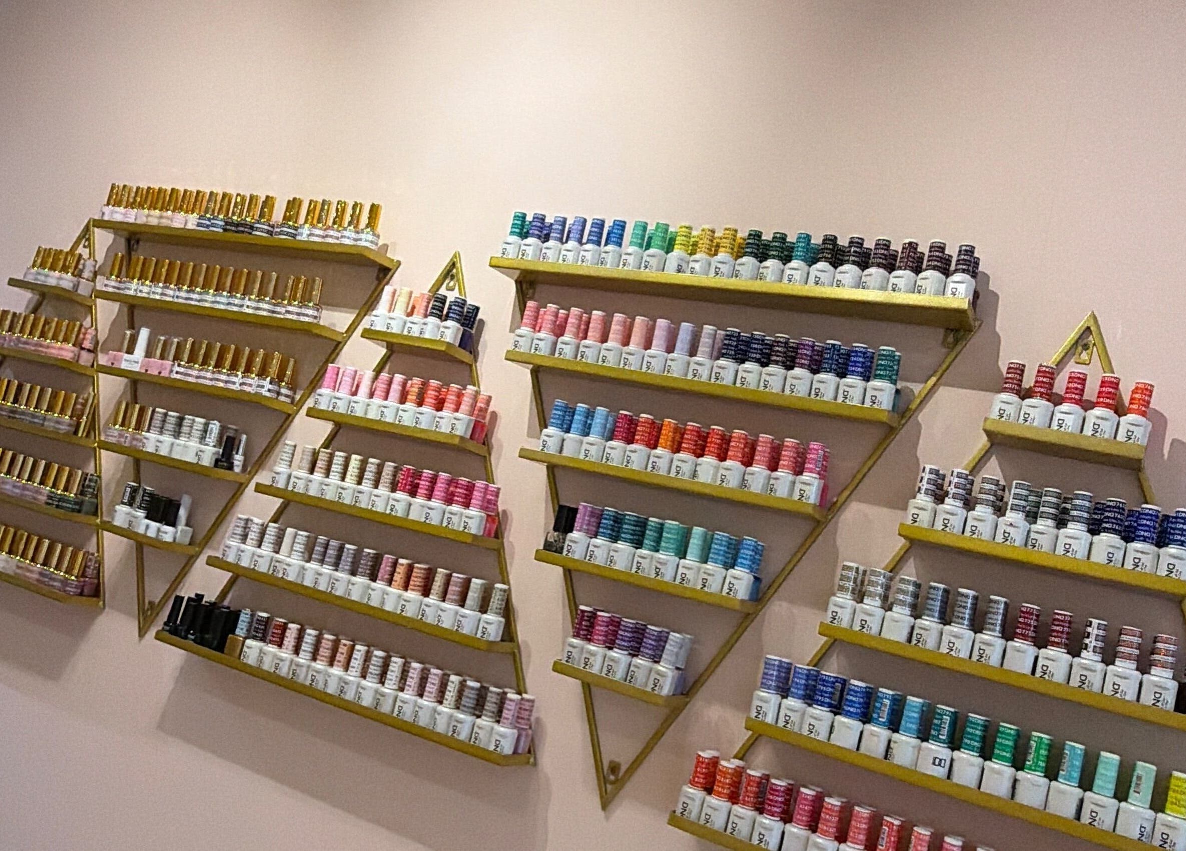 Colorful nail polish display at Hampstead Medspa, London, England, GB, showcasing vibrant selection.