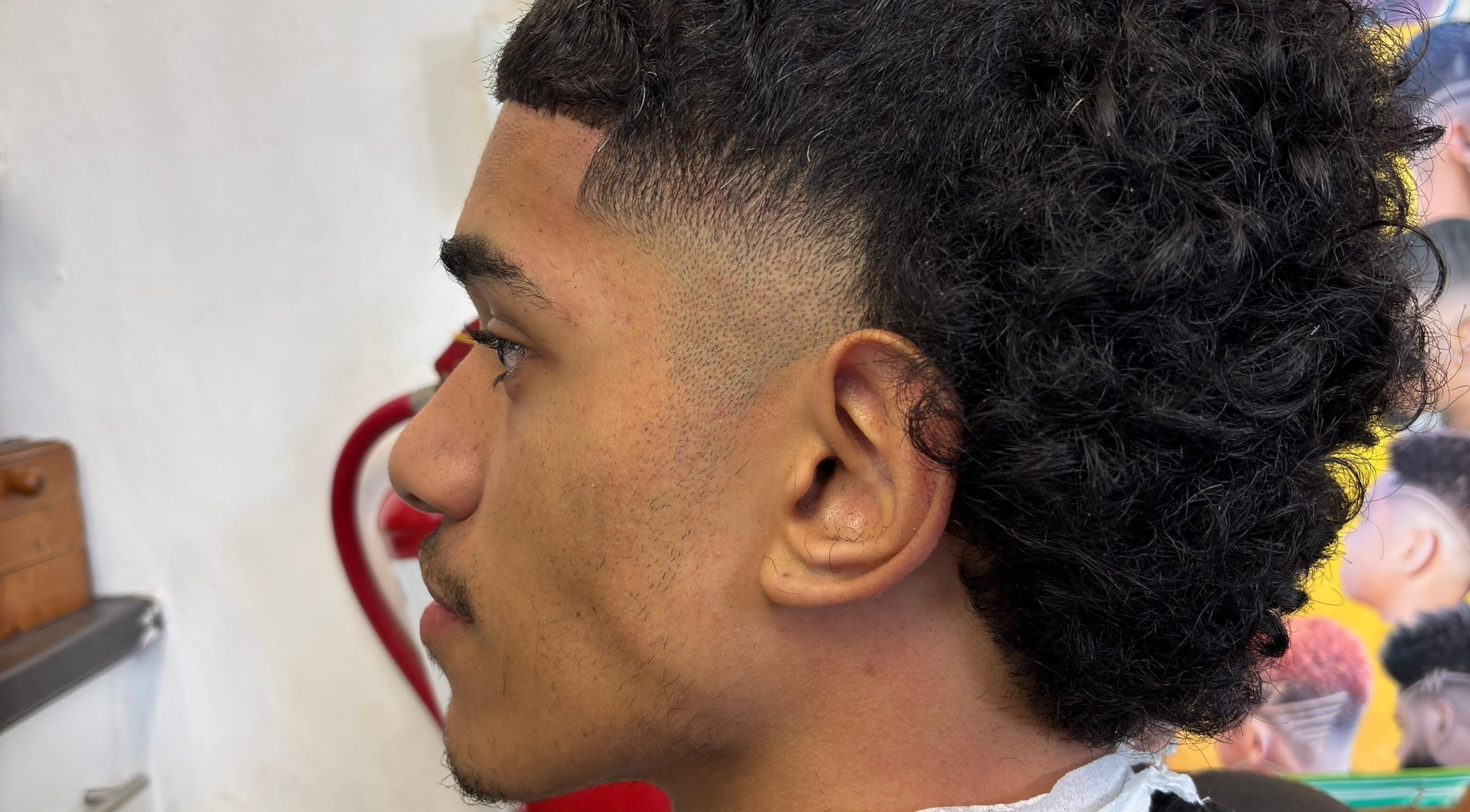 Close-up of a modern haircut at UNCLE'S barbershop, Cape Town, Western Cape, ZA.