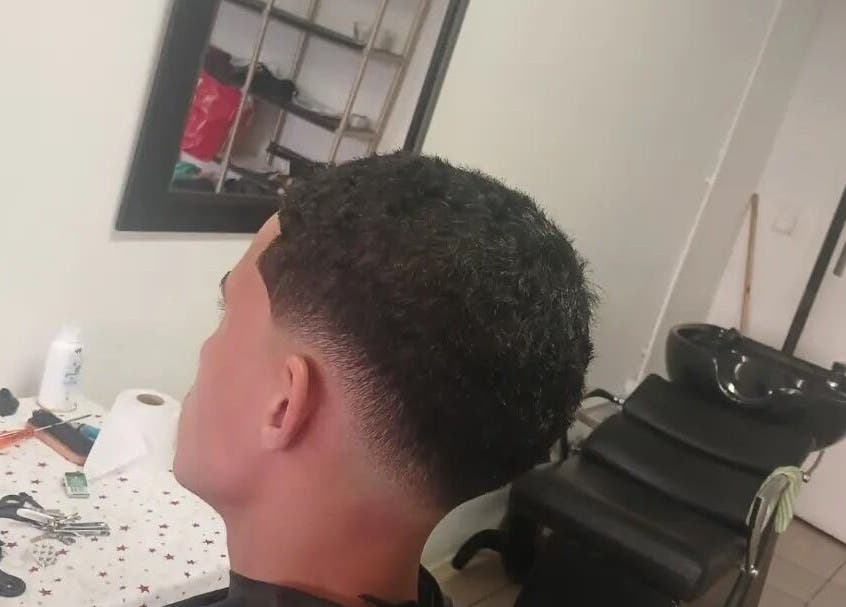 Stylish haircut at UNCLE'S barbershop, Cape Town, Western Cape, ZA. Modern grooming in a chic setting.