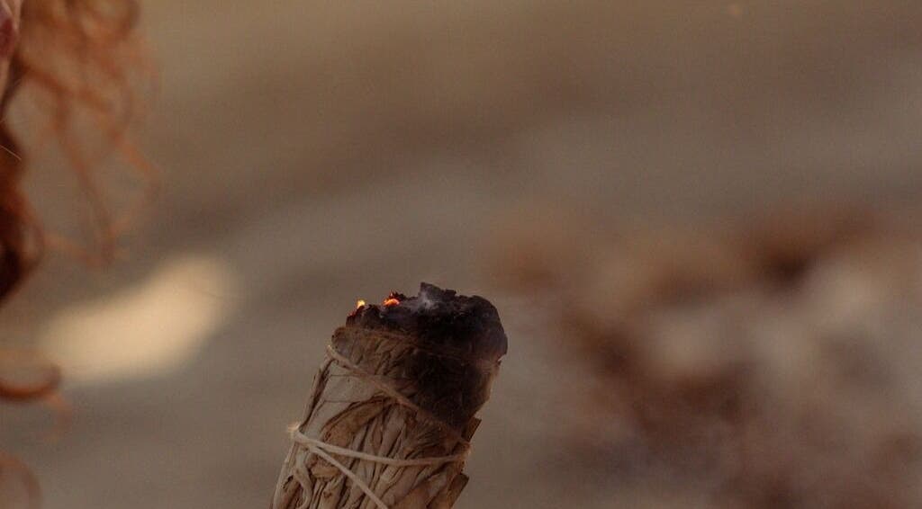 Burning sage at Languages of You in Bali, Bali, ID, creating a calming, spiritual ambiance.