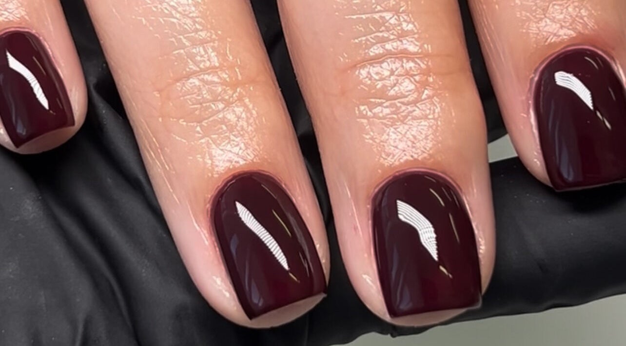 Glossy burgundy nails at Nail Haven By Chloe, Melbourne, Victoria, AU, showcasing expert manicure.