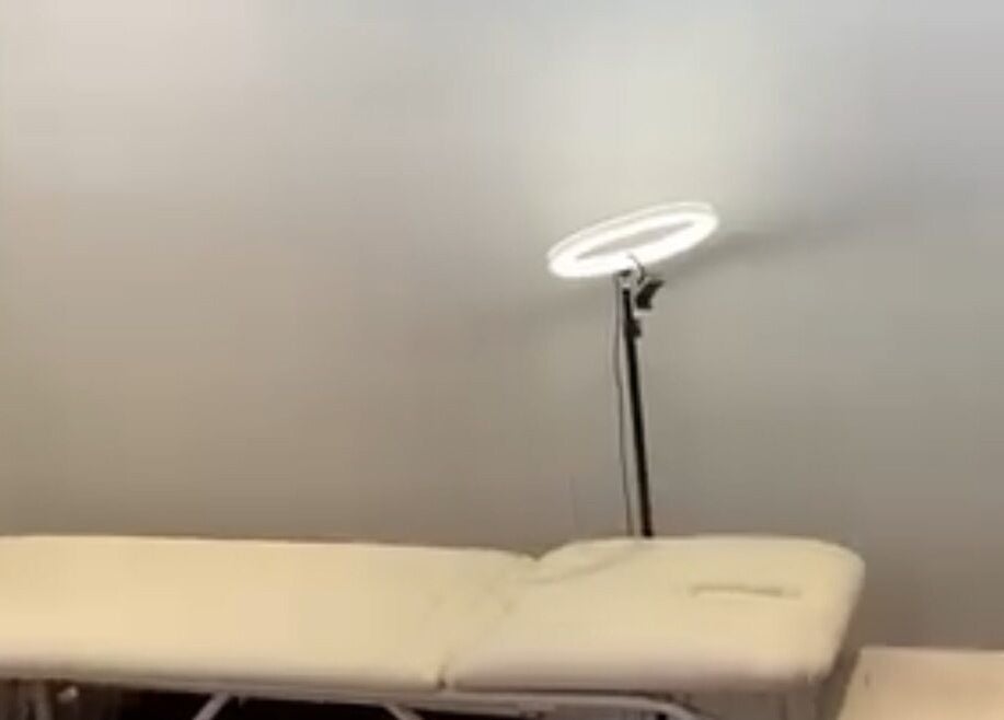 Treatment bed and ring light in Lashed by Tee, Cape Town, Western Cape, ZA, enhancing a calming spa ambiance.