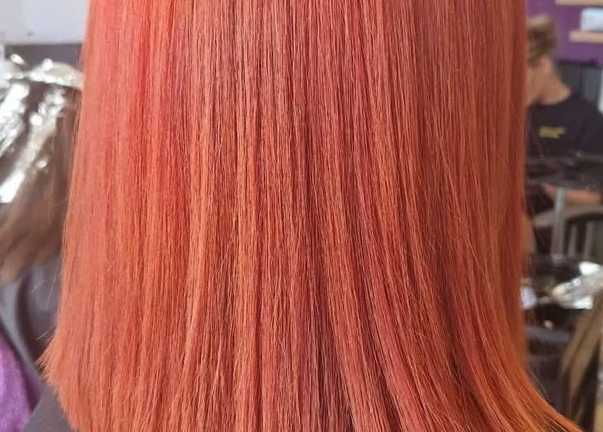 Vibrant red hair styled at KF Hair Beauty Lifestyle, Fleetwood, England, GB.