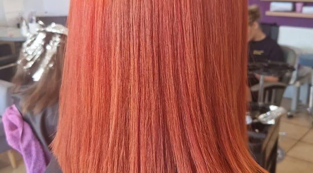 Vibrant red hair styled at KF Hair Beauty Lifestyle, Fleetwood, England, GB.