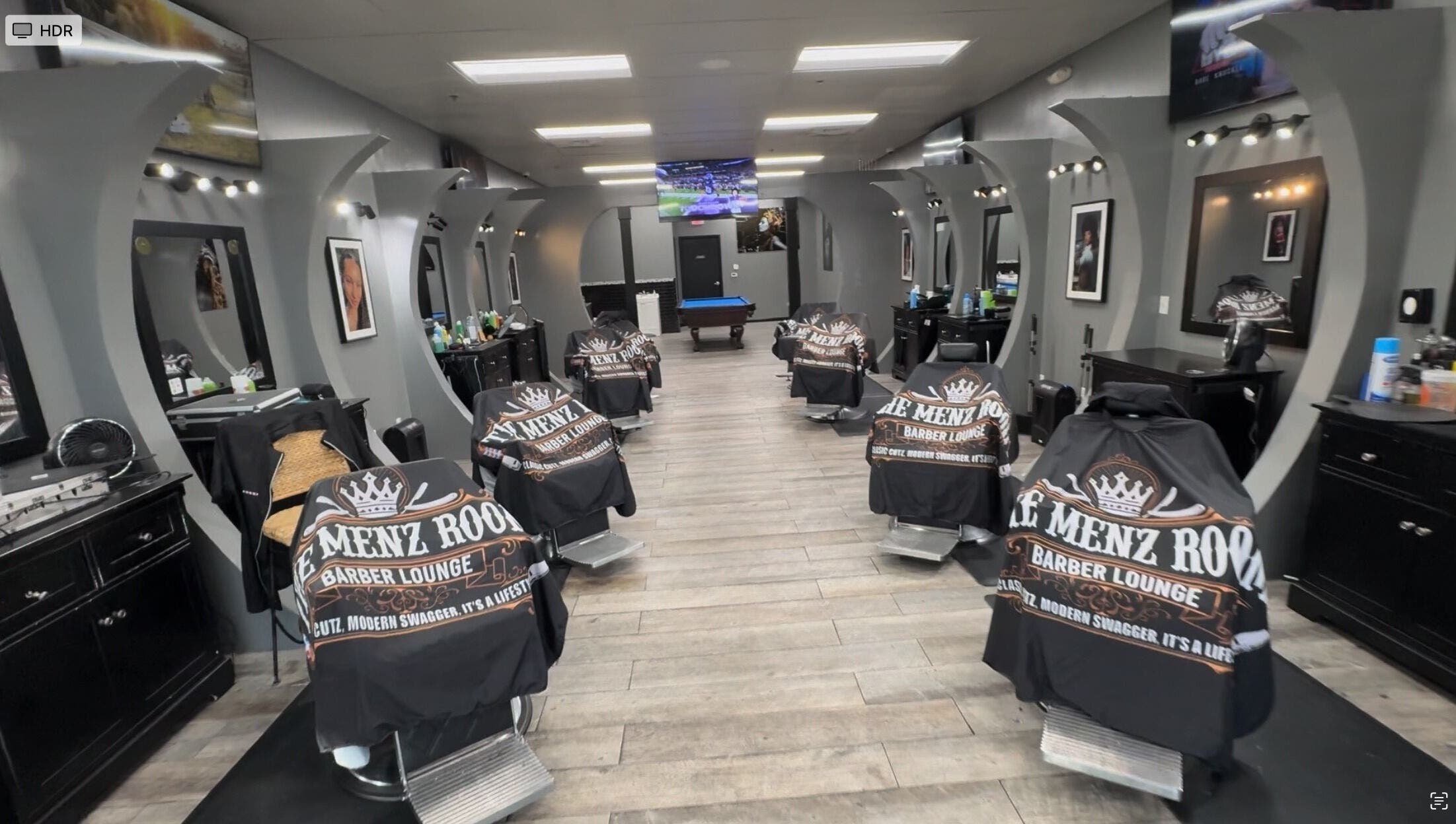Modern interior of SoloCutz barber shop in Bowie, Maryland, US featuring stylish barber chairs and mirrors.
