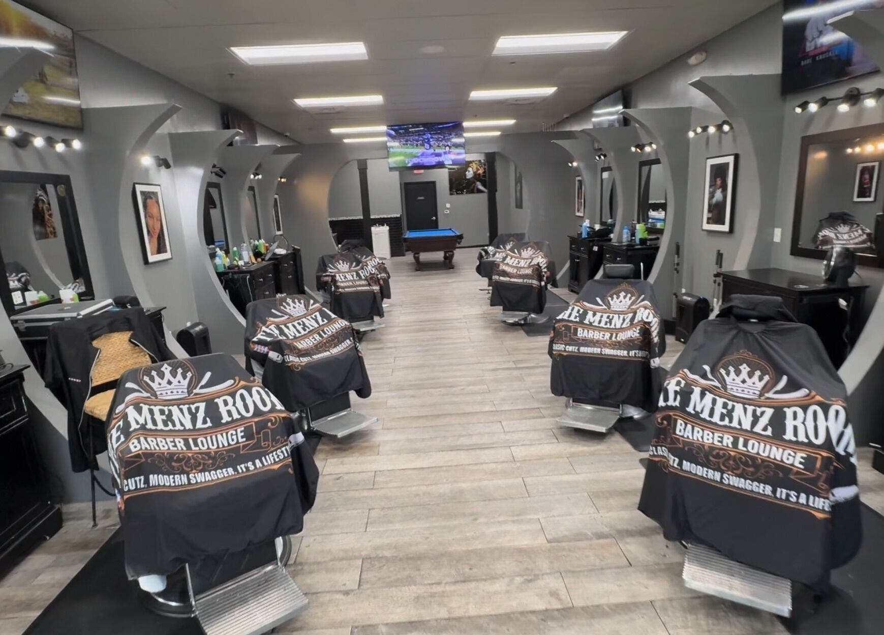 Modern interior of SoloCutz barber shop in Bowie, Maryland, US featuring stylish barber chairs and mirrors.