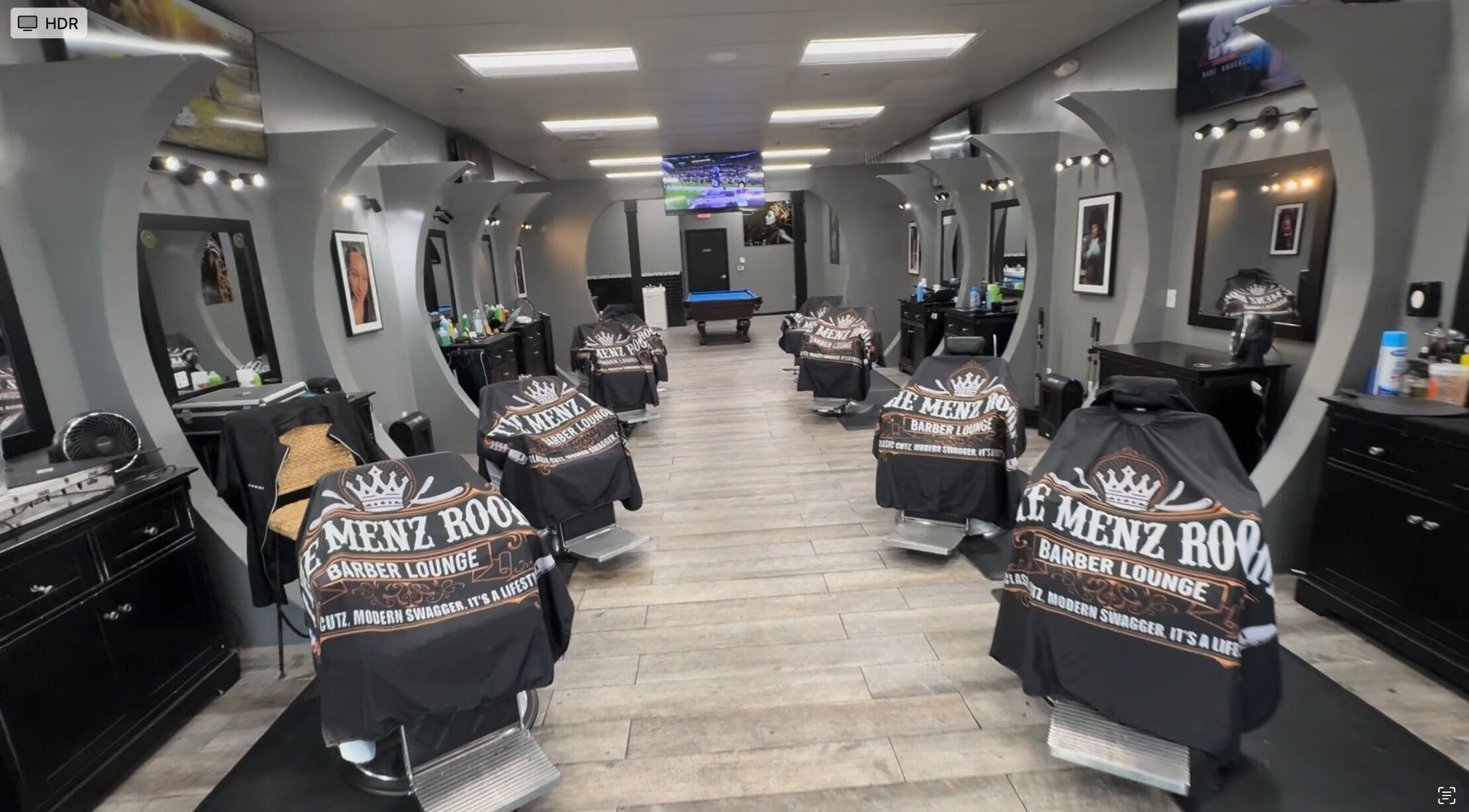 Modern interior of SoloCutz barber shop in Bowie, Maryland, US featuring stylish barber chairs and mirrors.
