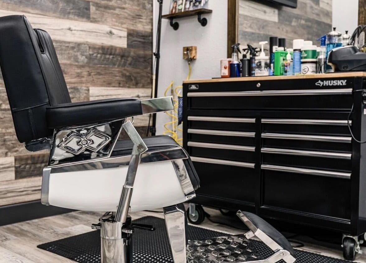 Modern barber chair at SoloCutz in Bowie, Maryland, US, exuding comfort and style near a sleek tool cabinet.