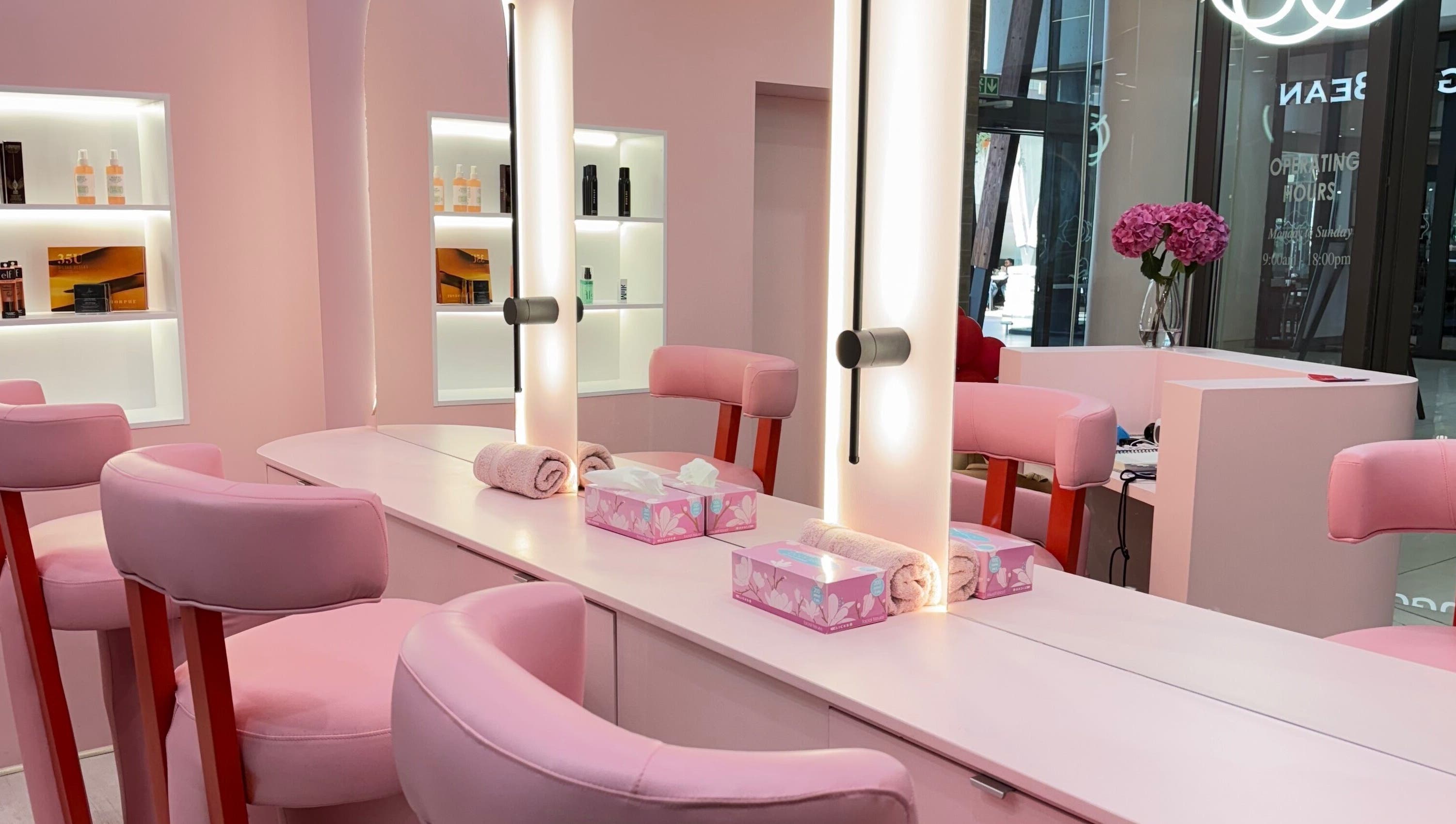 Chic pink salon interior at Lethal Beauty in Midrand, Gauteng, ZA, showcasing modern styling stations.