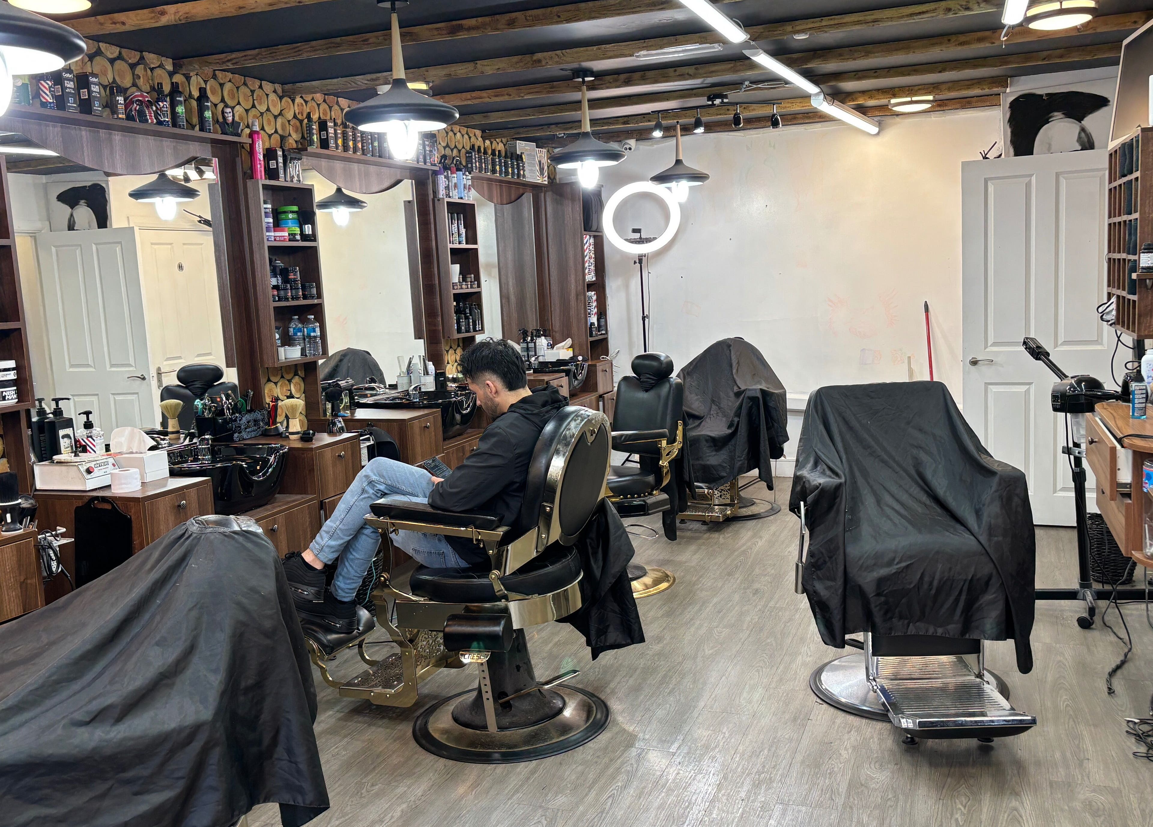 Interior of M&k barbers in Brighton And Hove, England, GB, featuring modern chairs and grooming essentials.