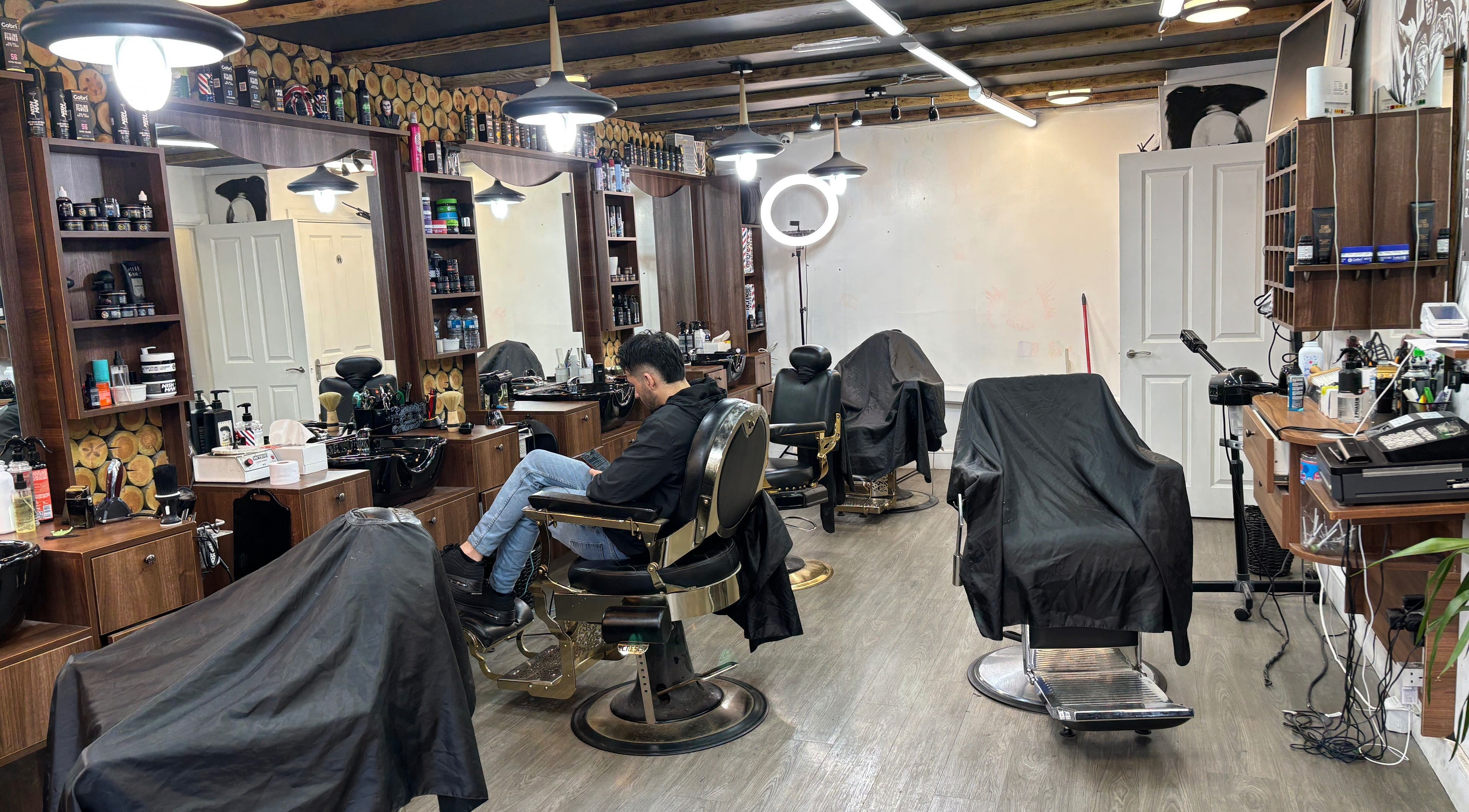 Interior of M&k barbers in Brighton And Hove, England, GB, featuring modern chairs and grooming essentials.