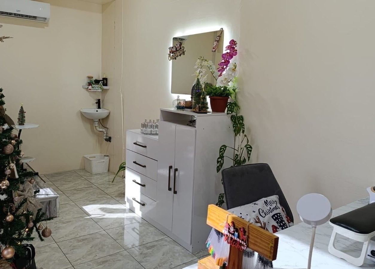 Cozy interior of Petite Artistic Touch in Wanica, SR, adorned with a festive Christmas tree and elegant decor.