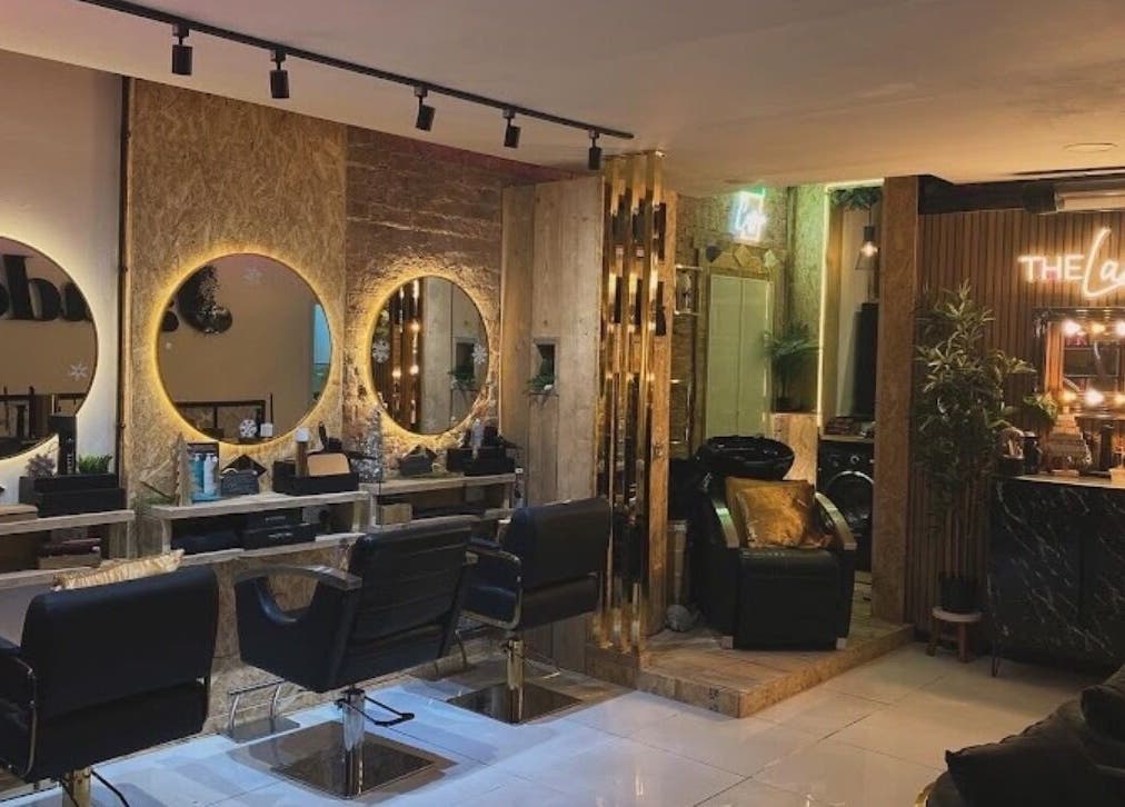 Chic interior of Beauty By Payton salon in Sunderland, England, GB, showcasing elegant styling stations and lush decor.