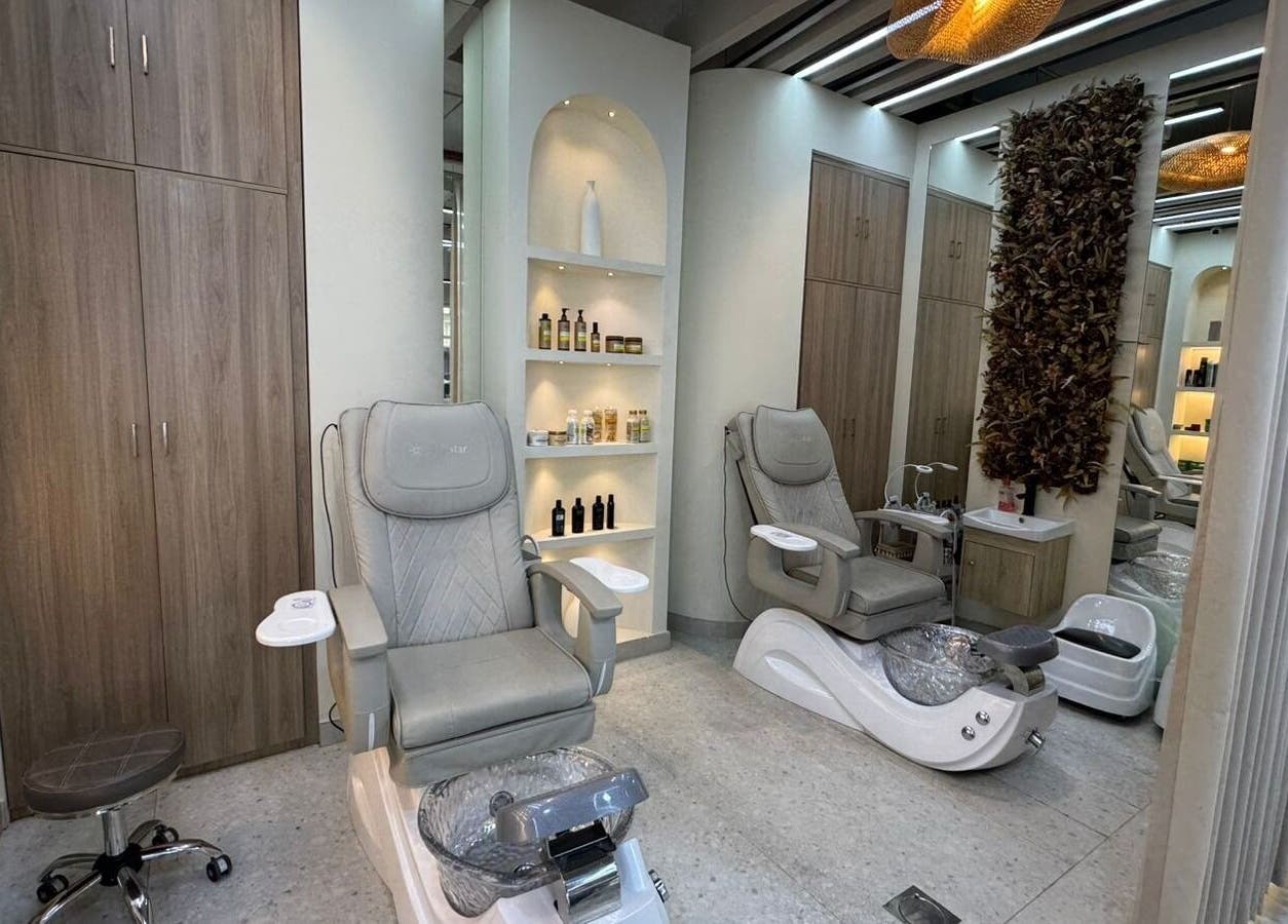 Elegant interior of Three Brothers Barbershop in Sharjah, AE with luxurious pedicure chairs and stylish decor.