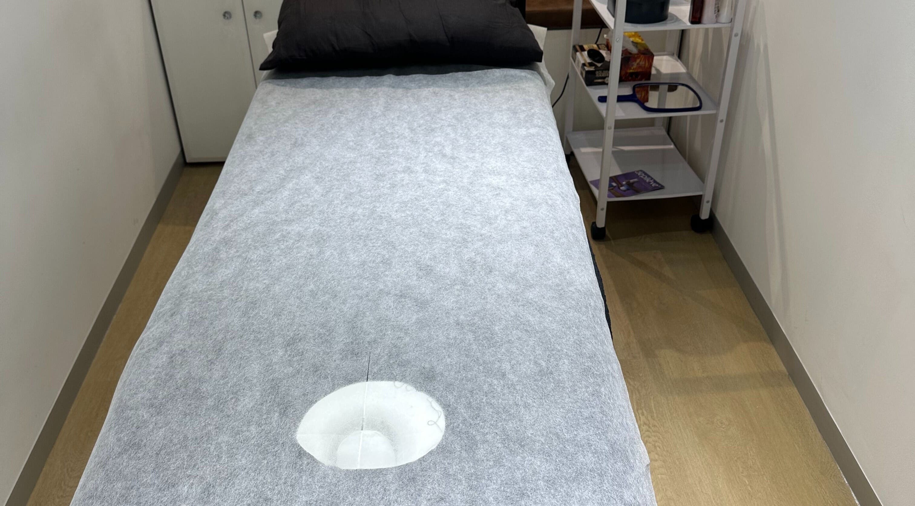 Relaxing treatment bed at Wax On Wax Off, Sea Point, Western Cape, ZA, ready for a rejuvenating session.