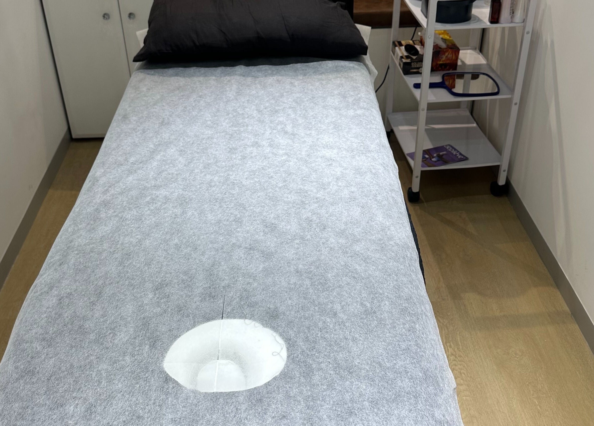 Treatment bed at Wax On Wax Off, Cape Town, Western Cape, ZA, inviting relaxation.