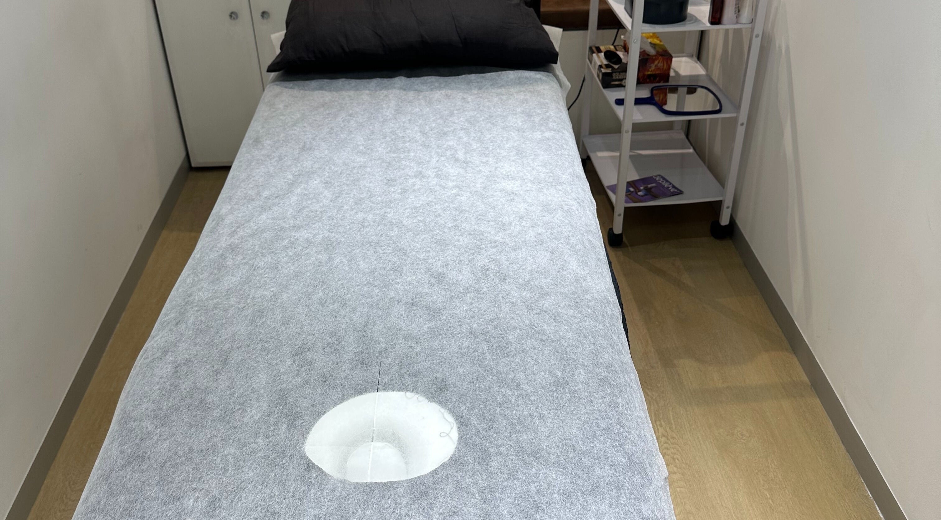 Treatment bed at Wax On Wax Off, Cape Town, Western Cape, ZA, inviting relaxation.