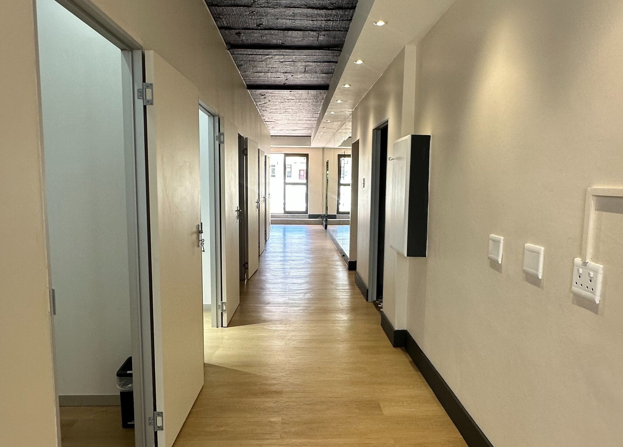 Spacious hallway at Wax On Wax Off, Cape Town, Western Cape, ZA, with open doors and stylish lighting.