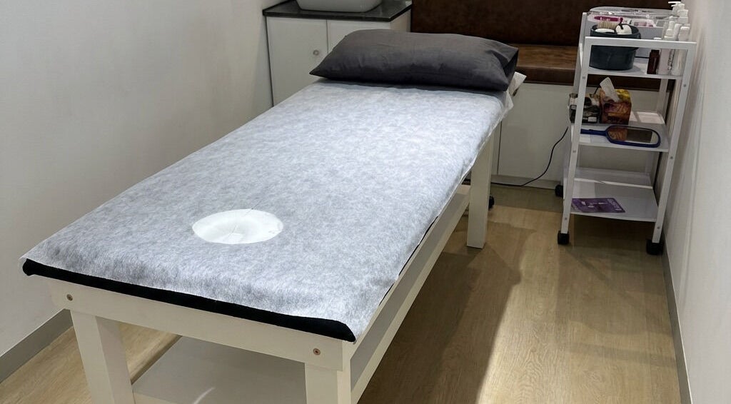 Tranquil treatment room at Wax On Wax Off, Cape Town, Western Cape, ZA. Cozy bed setup in a clean, modern space.