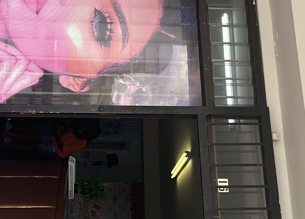 Entrance of Mel’sGlam Studio in Johannesburg, Gauteng, ZA with vibrant window signage.