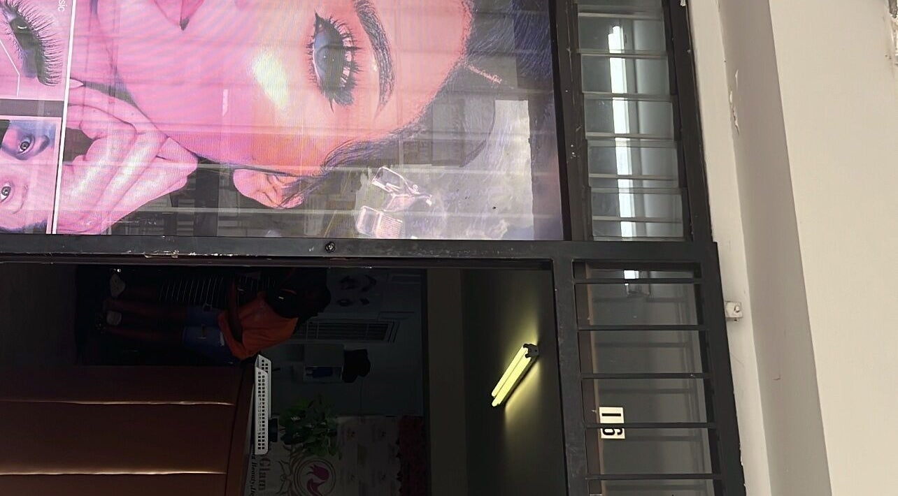 Entrance of Mel’sGlam Studio in Johannesburg, Gauteng, ZA with vibrant window signage.