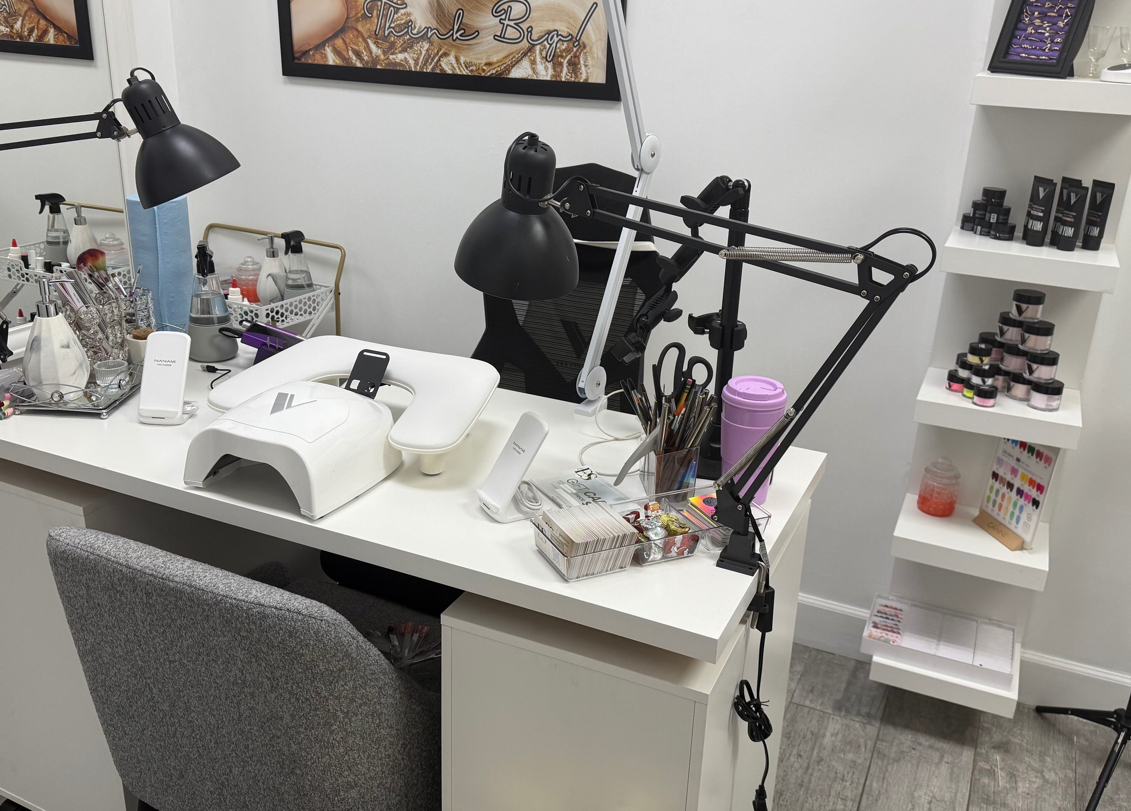 Eyra Studio Nails' workstation with tools and polish in Chandler, Arizona, US, showcasing a stylish, organized setup.