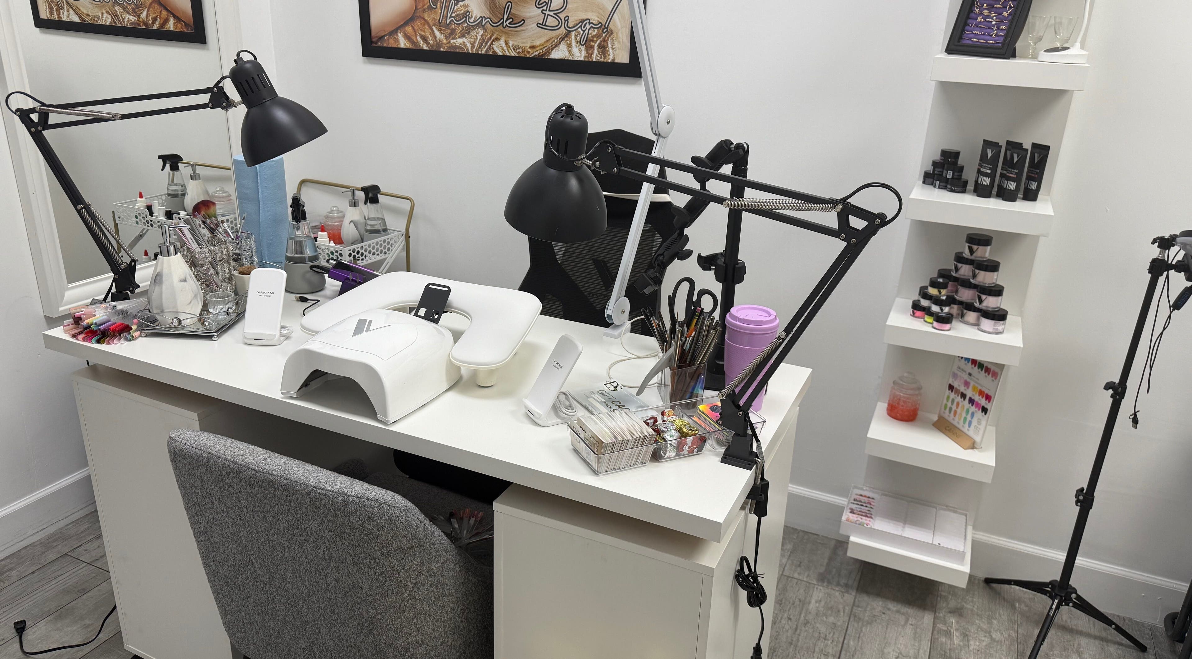 Eyra Studio Nails' workstation with tools and polish in Chandler, Arizona, US, showcasing a stylish, organized setup.