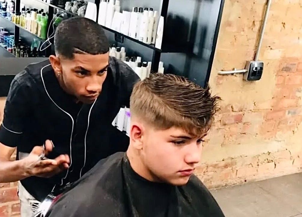 Barber crafting a stylish haircut at Xdabarber, Pretoria, Gauteng, ZA, showcasing professional grooming.