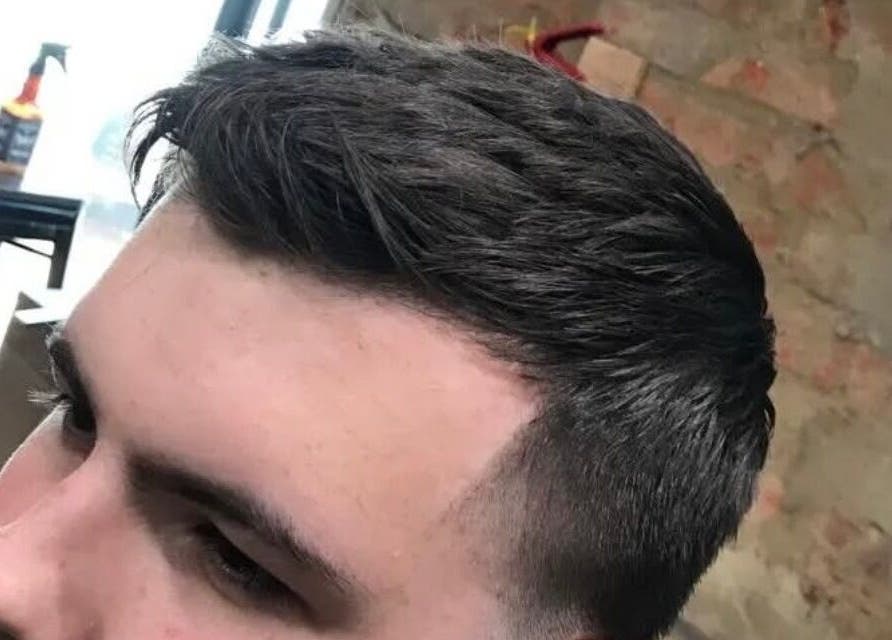 Close-up of a stylish men's haircut at Xdabarber, Pretoria, Gauteng, ZA.