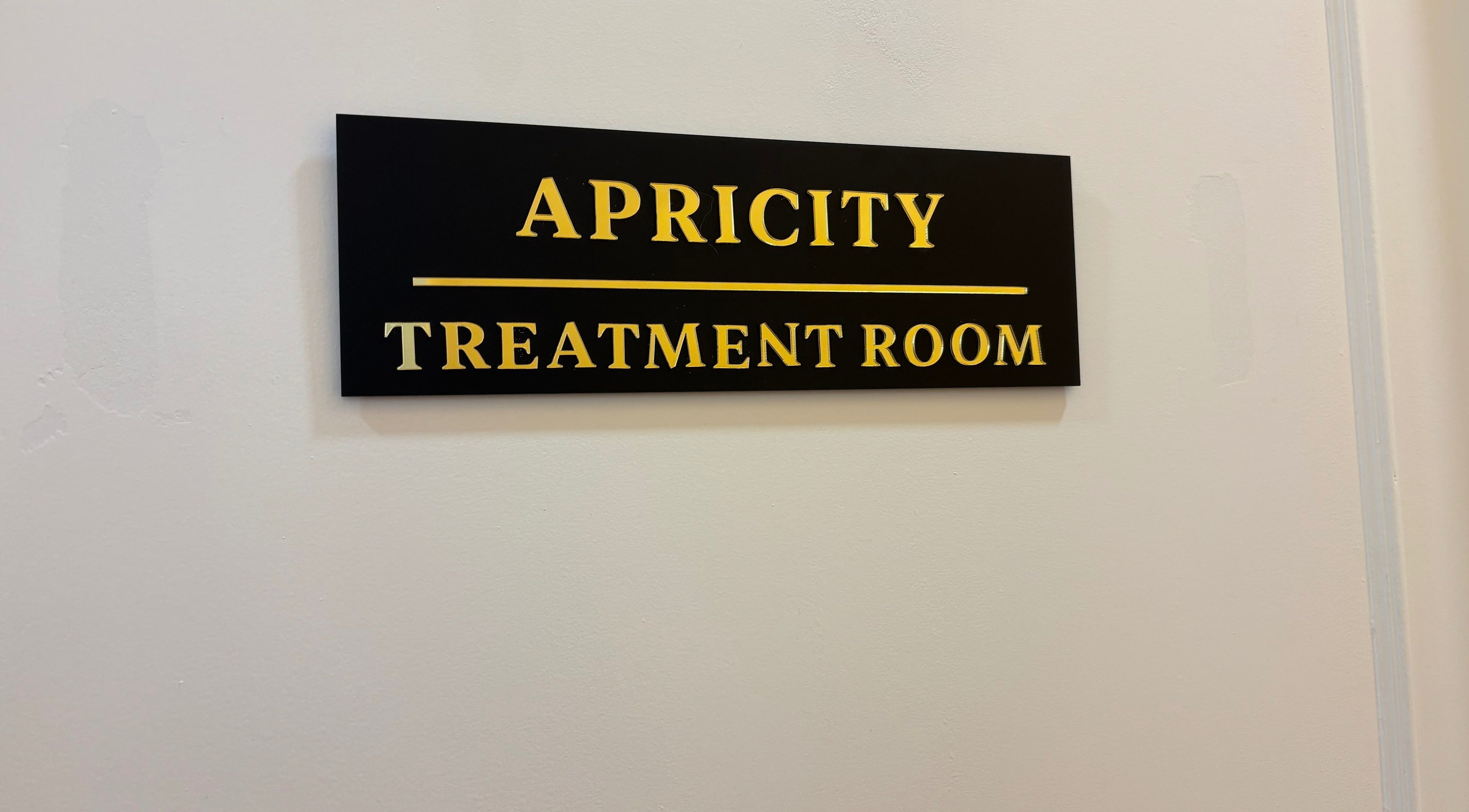 Apricity Healthcare treatment room sign in Bristol, England, GB.