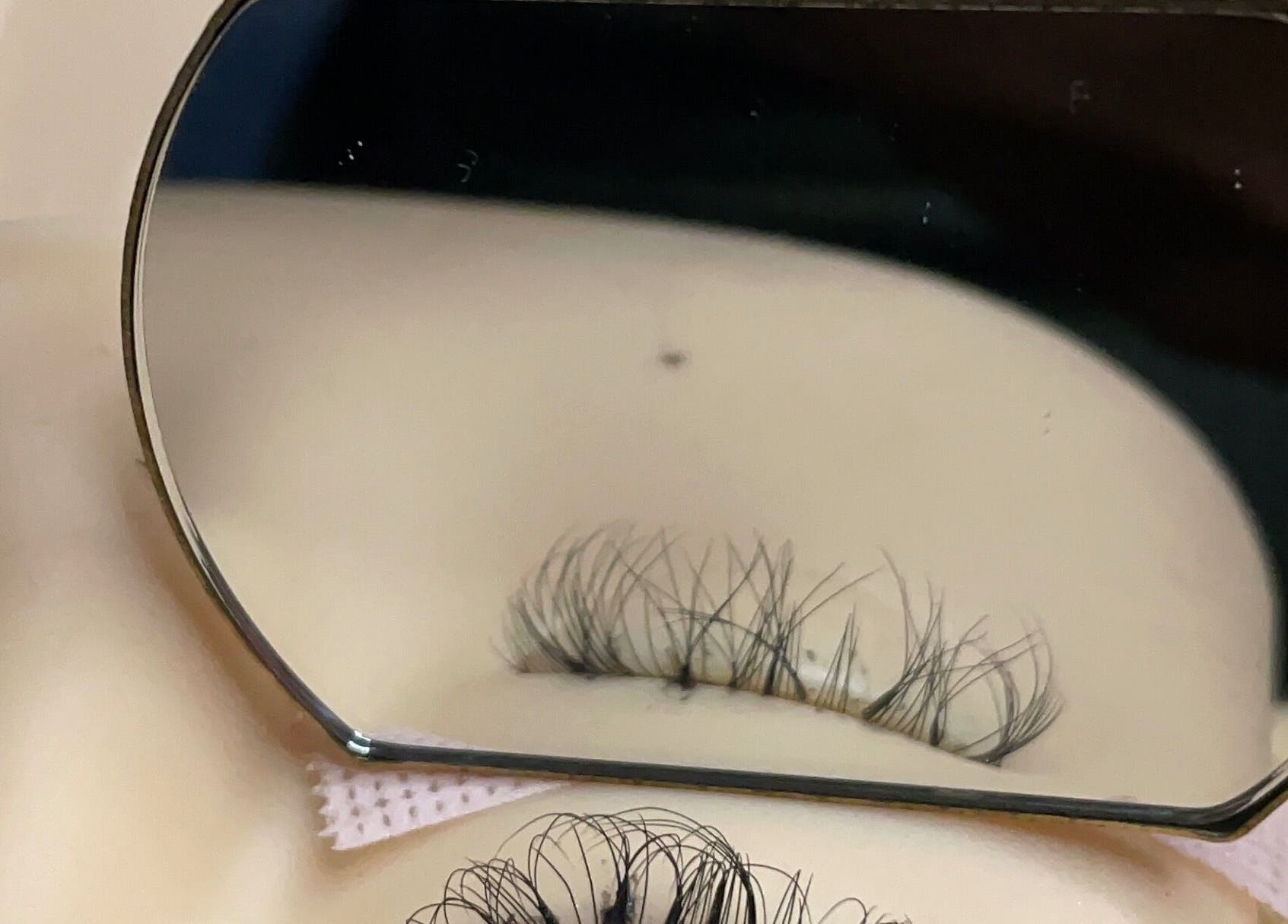 Close-up of eyelash extensions at Simply Mirror Beauty Studio, Benoni, Gauteng, ZA, with precision in mirror.