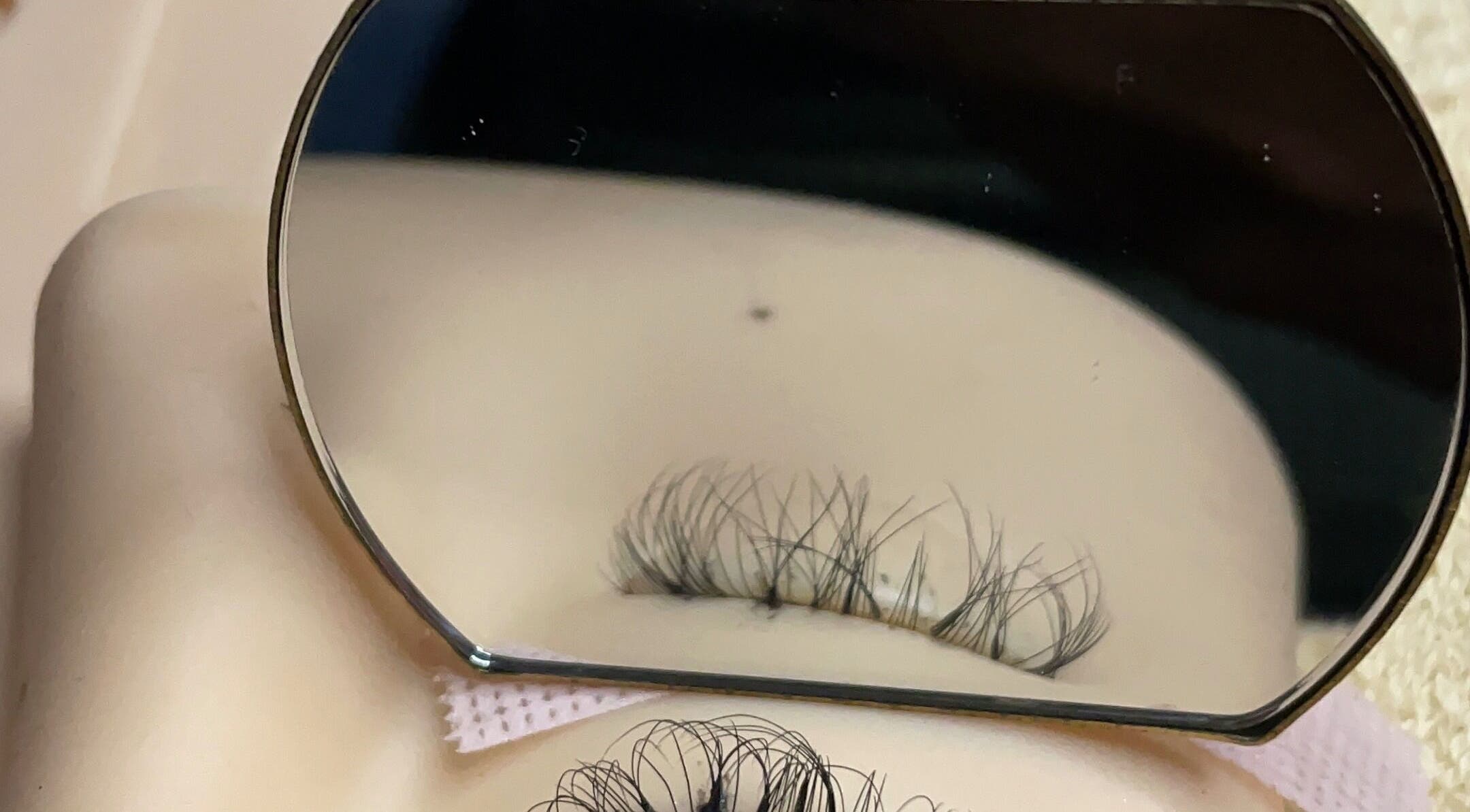 Close-up of eyelash extensions at Simply Mirror Beauty Studio, Benoni, Gauteng, ZA, with precision in mirror.