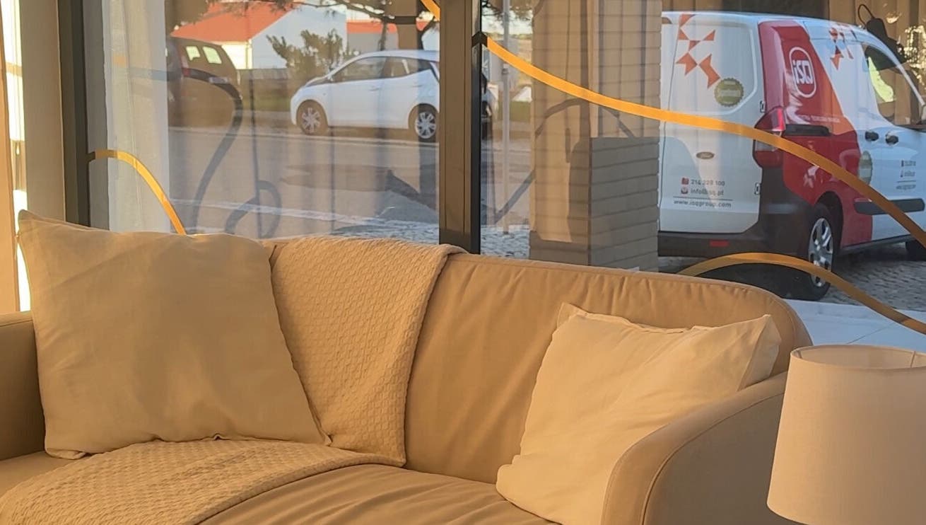 Relaxing beige sofa in Lash Care, São Domingos De Rana, Lisboa, PT near large windows with natural light.