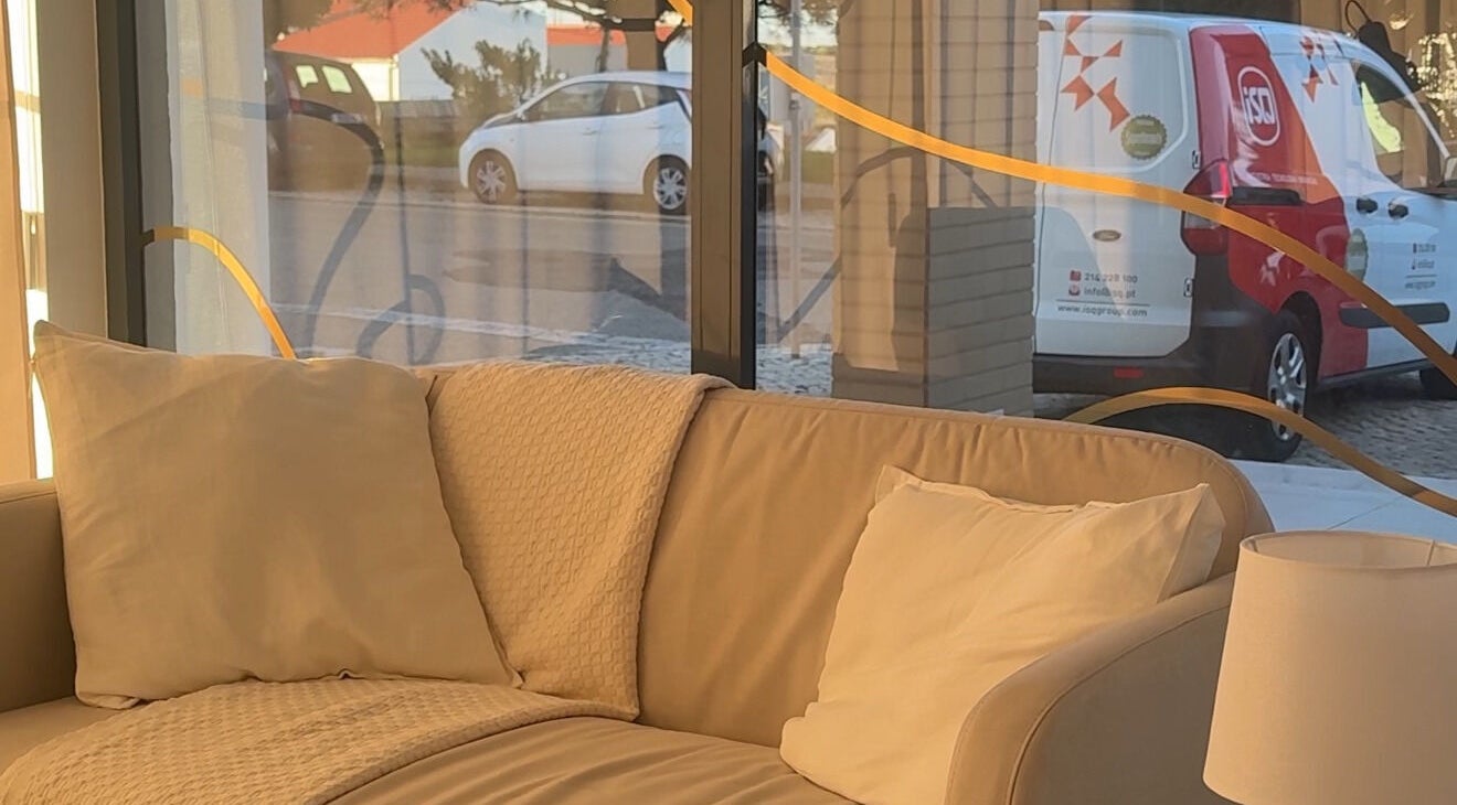 Relaxing beige sofa in Lash Care, São Domingos De Rana, Lisboa, PT near large windows with natural light.