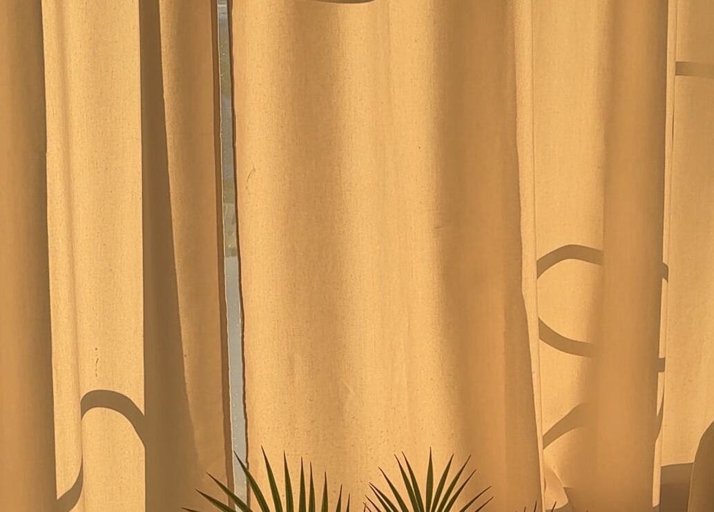 Sunlight filters through curtains at Lash Care in São Domingos De Rana, Lisboa, PT, creating a warm ambiance.