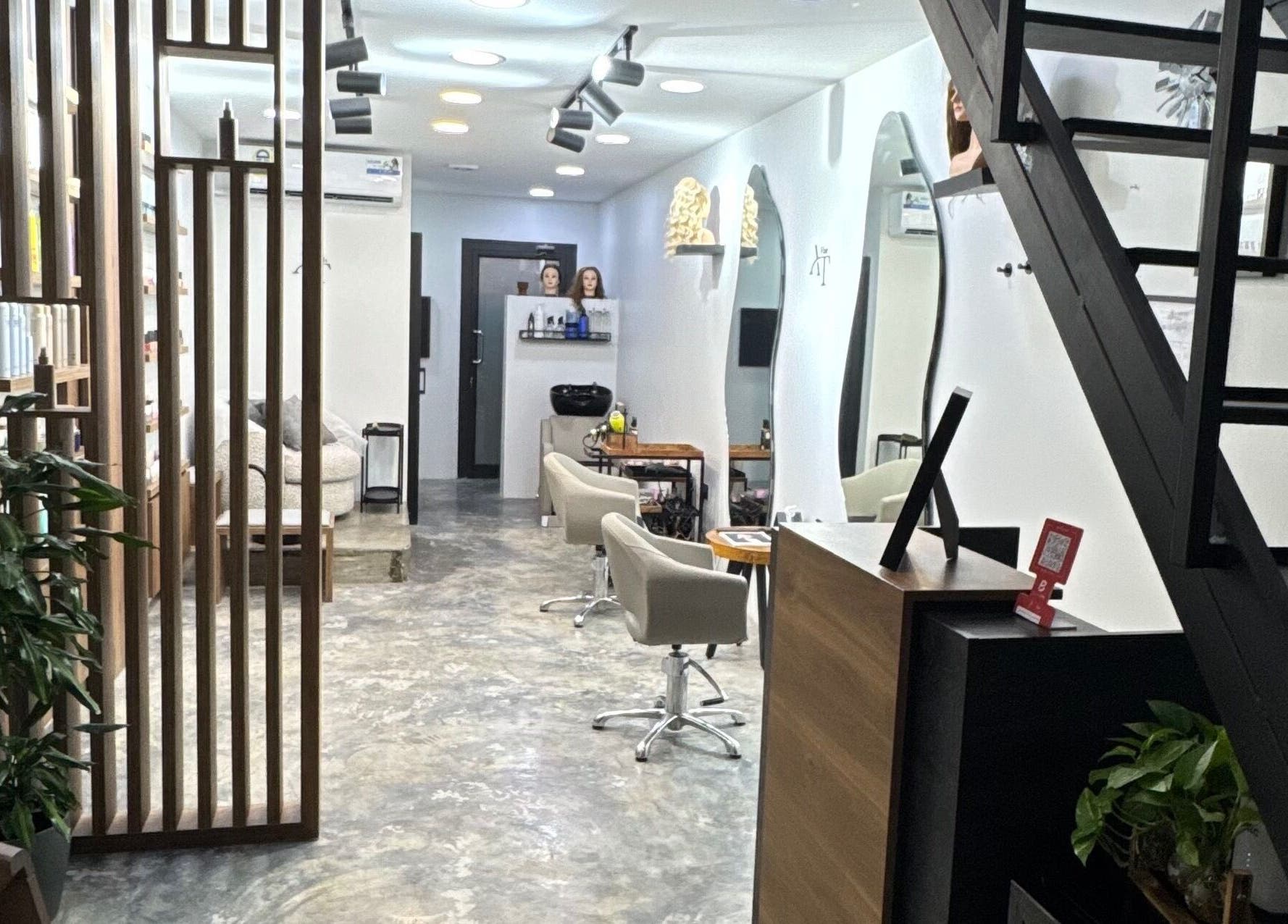 Modern interior of Ameeri Touch Hair & Beauty in Bu Quwah, BH with stylish decor and seating.