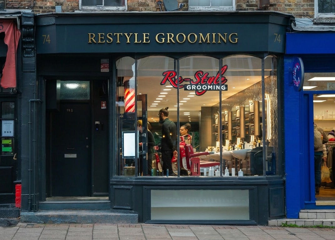 Front view of Re-Style Highgate salon in London, England, GB with elegant storefront and window displays.