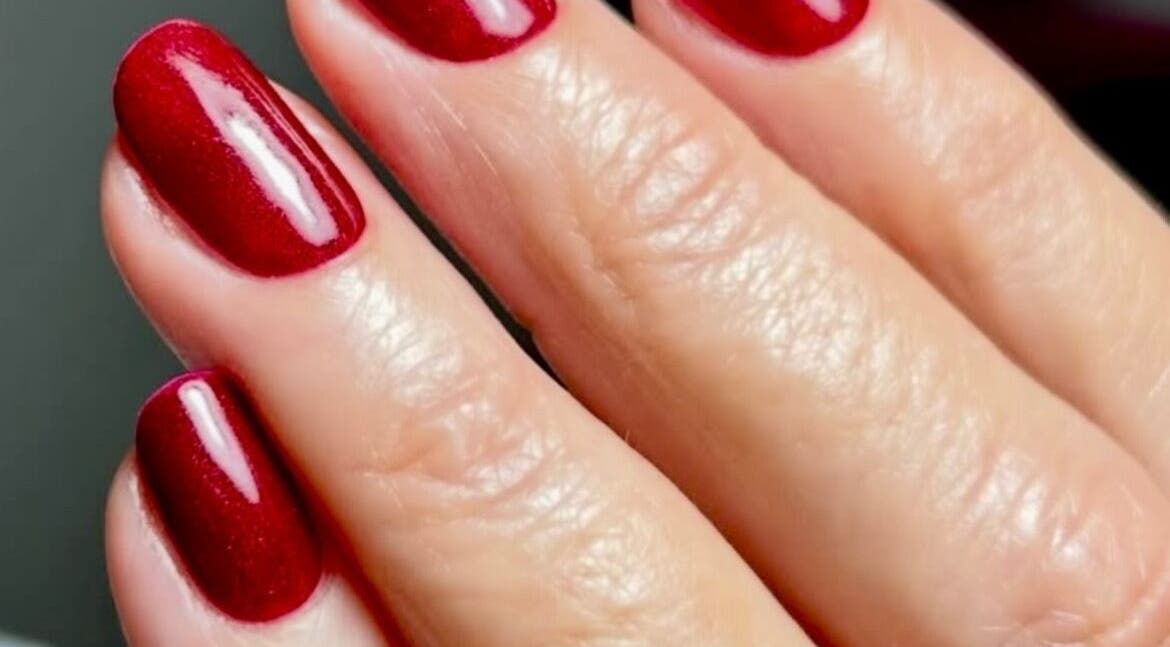 Elegant red manicured nails at Beautybyjadeleeds, Pudsey, England, GB showcasing flawless nail design.
