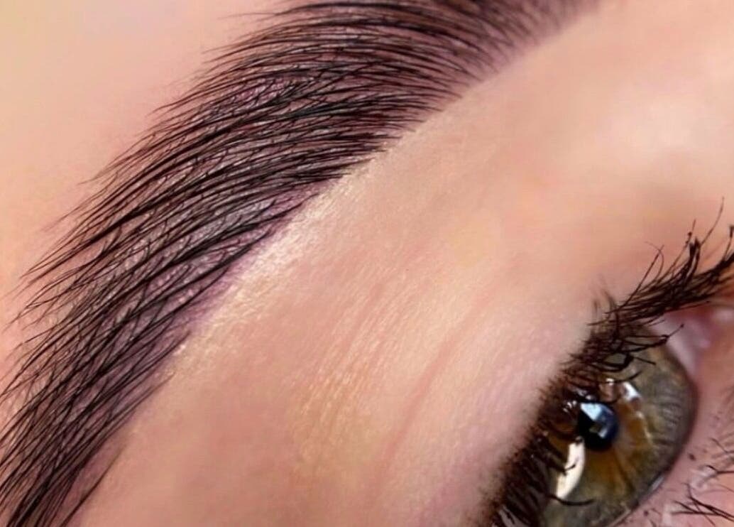 Close-up of beautifully groomed eyebrow showcasing Beauty by Yulia's skill in Cwmbran, Wales, GB.