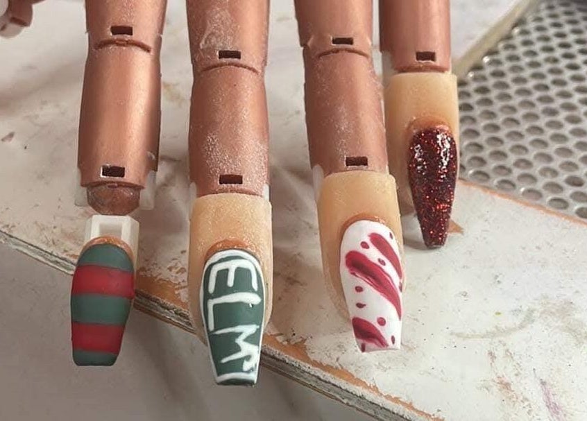 Intricate festive nail designs at Elevated Elegance Beauty, Lovelock, Nevada, US.