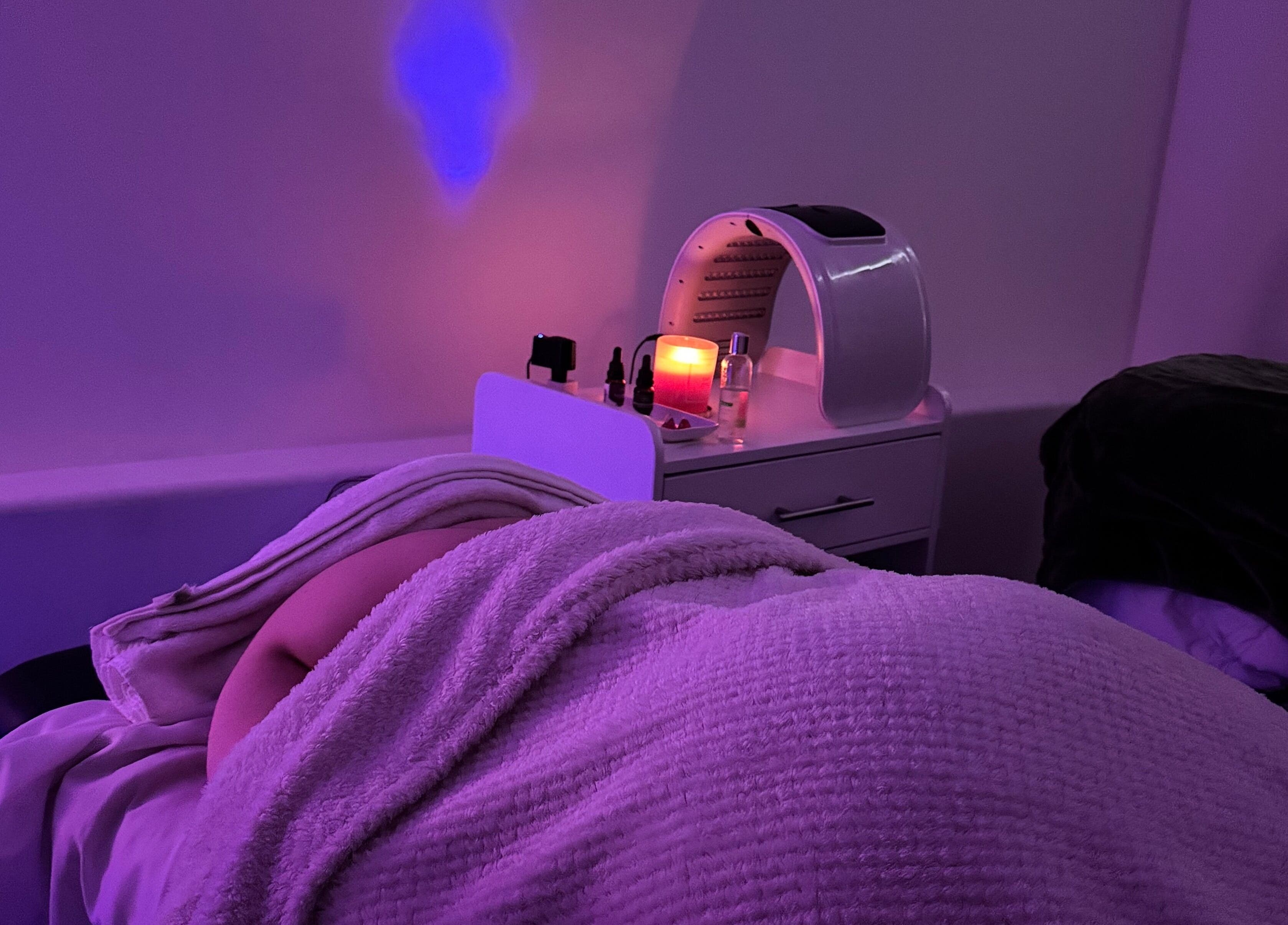 A relaxed guest enjoys a soothing spa experience at XERŪM Wellness Spa in Tijuana, Baja California, MX.